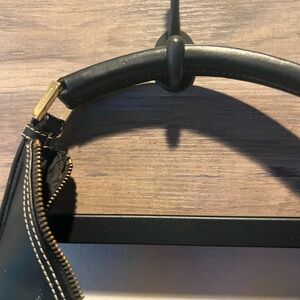 Smooth Black leather with gold tone hardware nice and clean